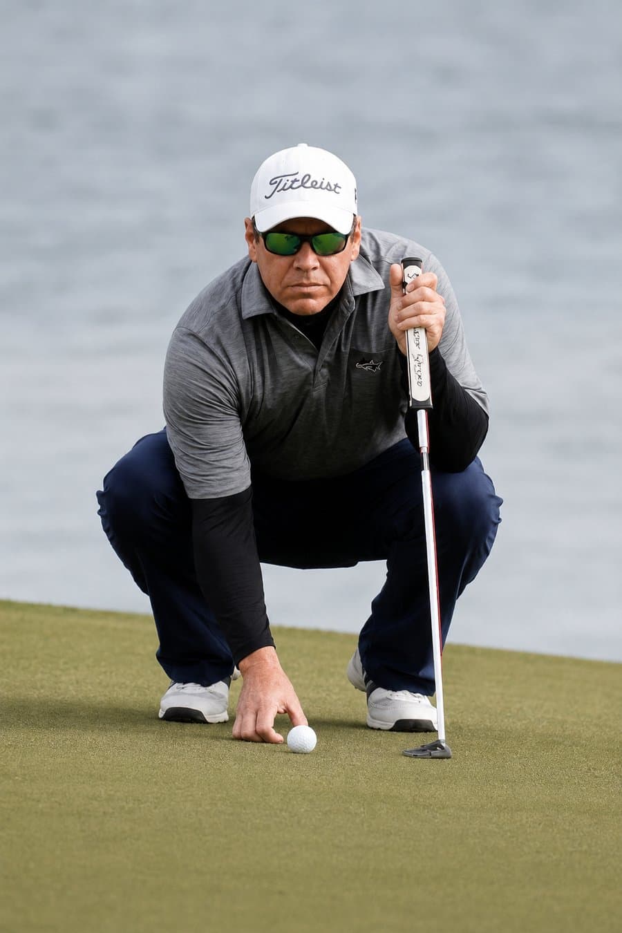 Gabe Ross lining up a putt